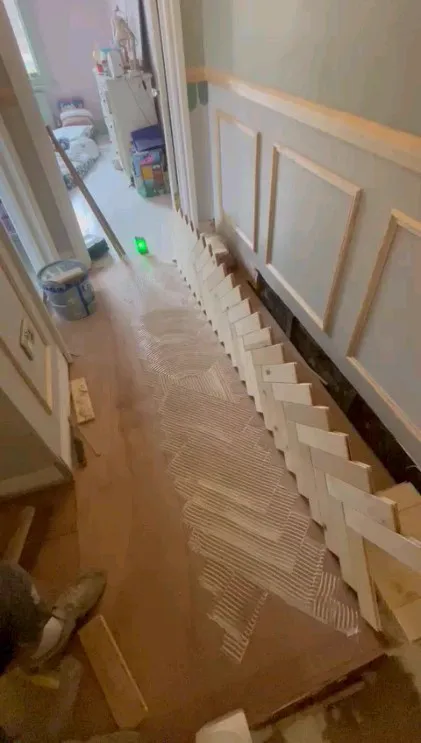 Oak herringbone parquet being installed in a Brixton SW9 home by Howard Naish