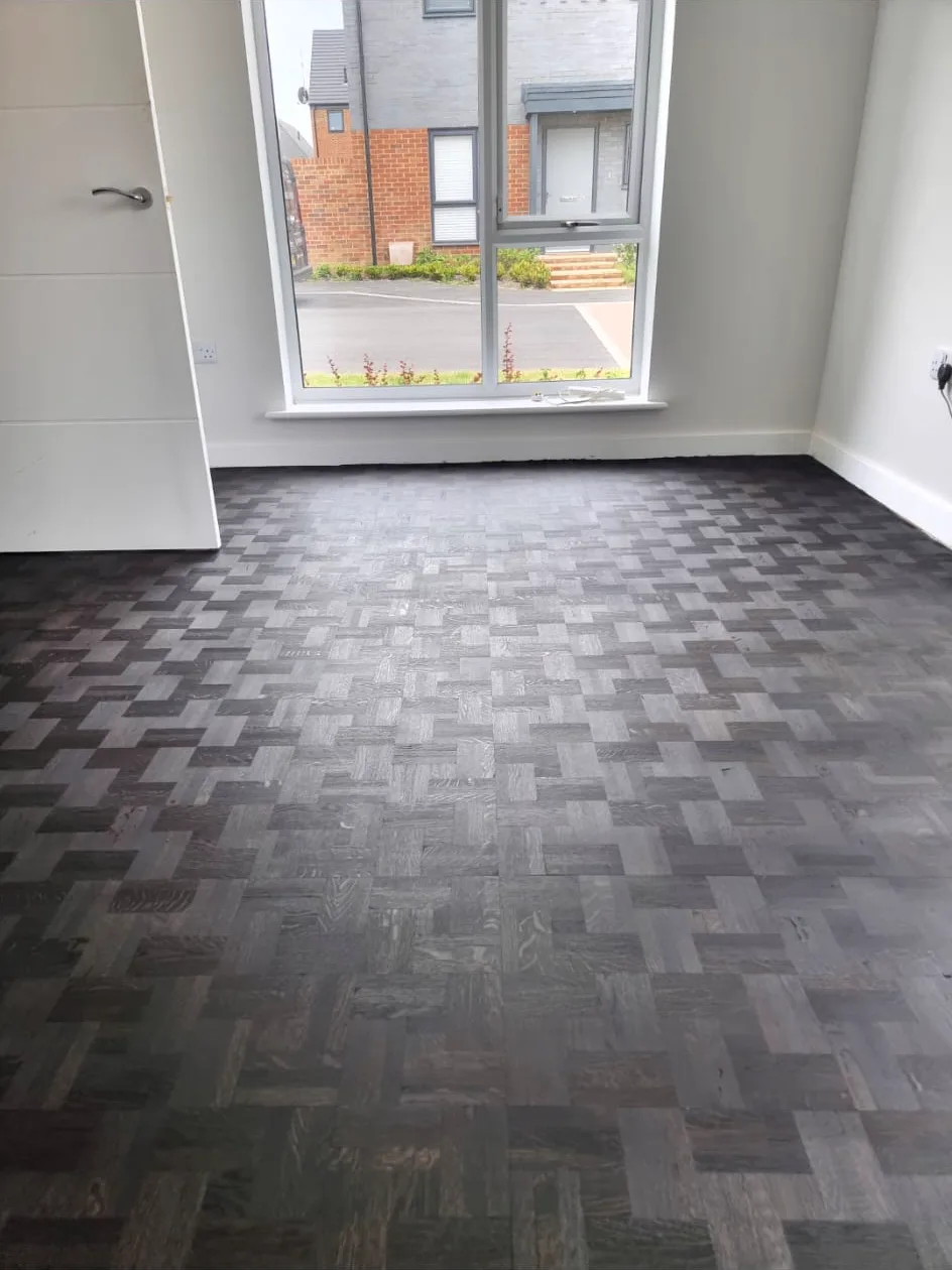 Finished black finger mosaic parquet floor in a Chipstead CR5 home, laid and stained on site by Howard Naish