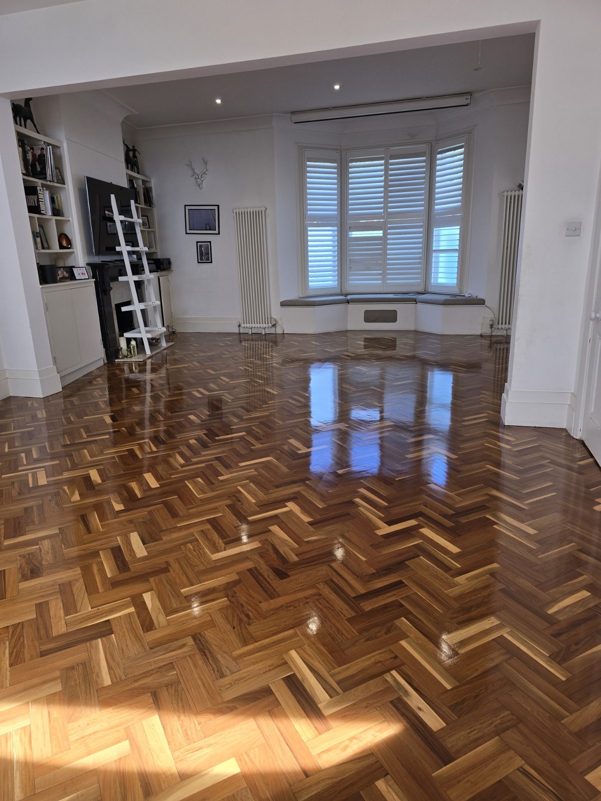 Original herringbone parquet in Clapham restored to a warm even finish by Howard Naish