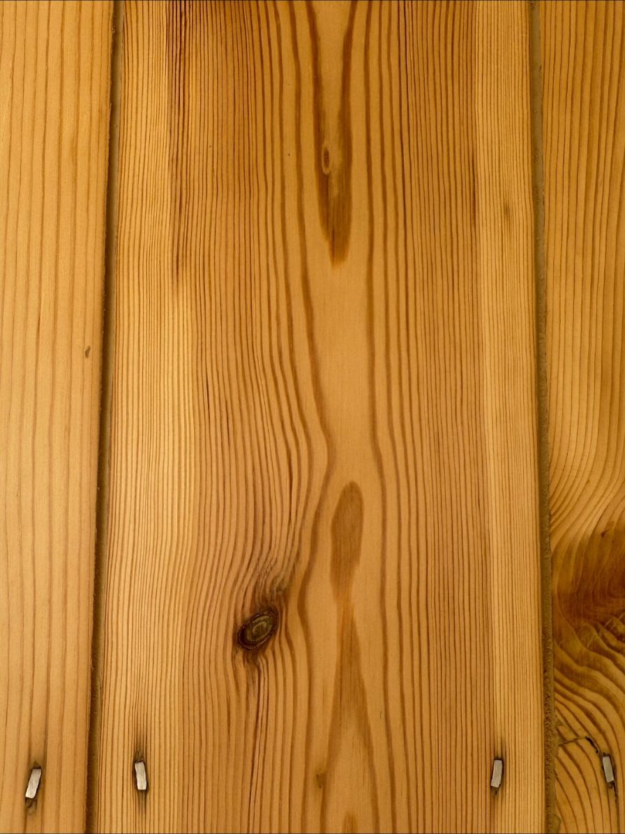 Medium oak toned flexible filler between warm-toned original pine floorboards