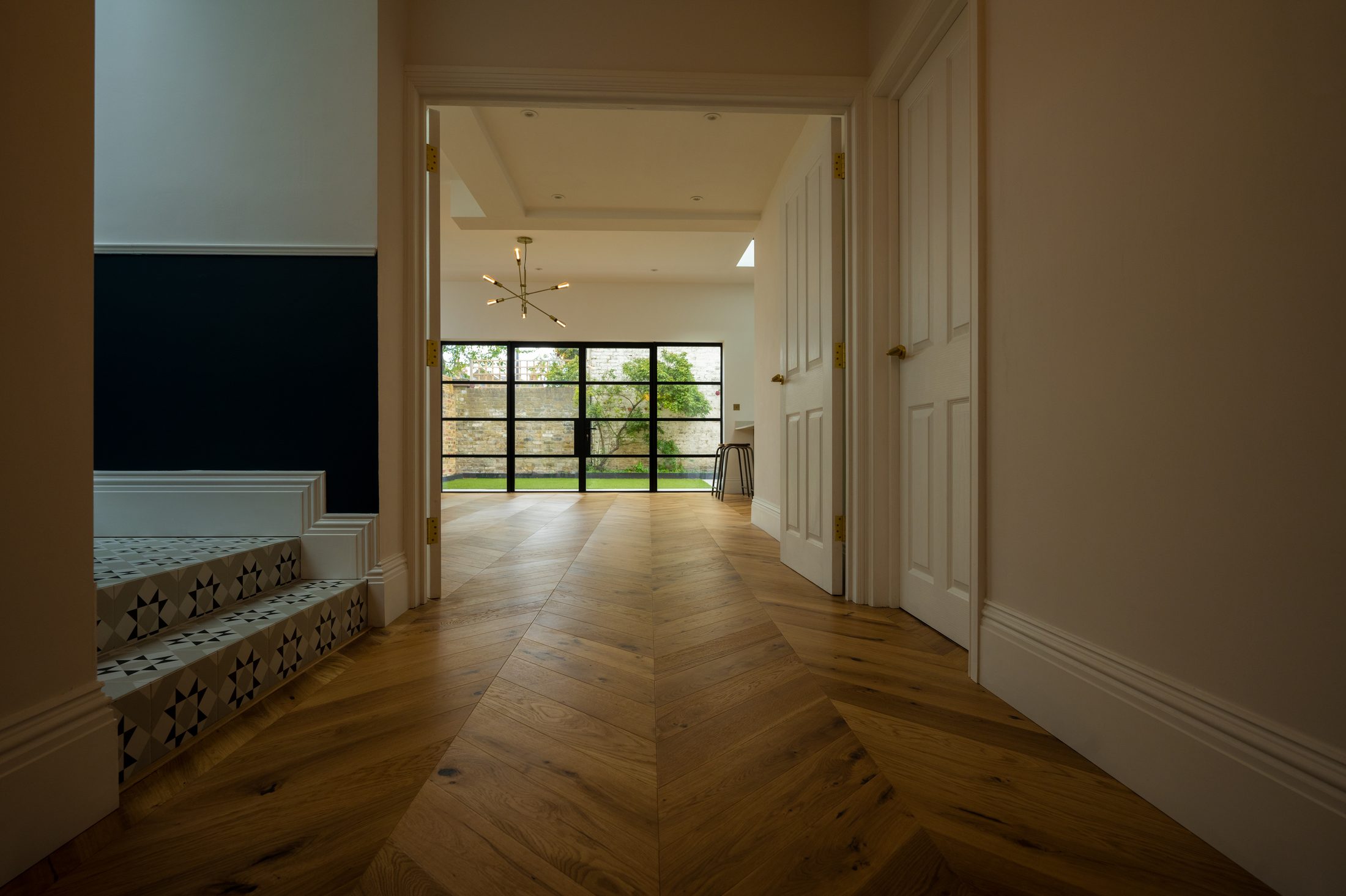 Chevron oak floor restored and finished by Howard Naish in a London home