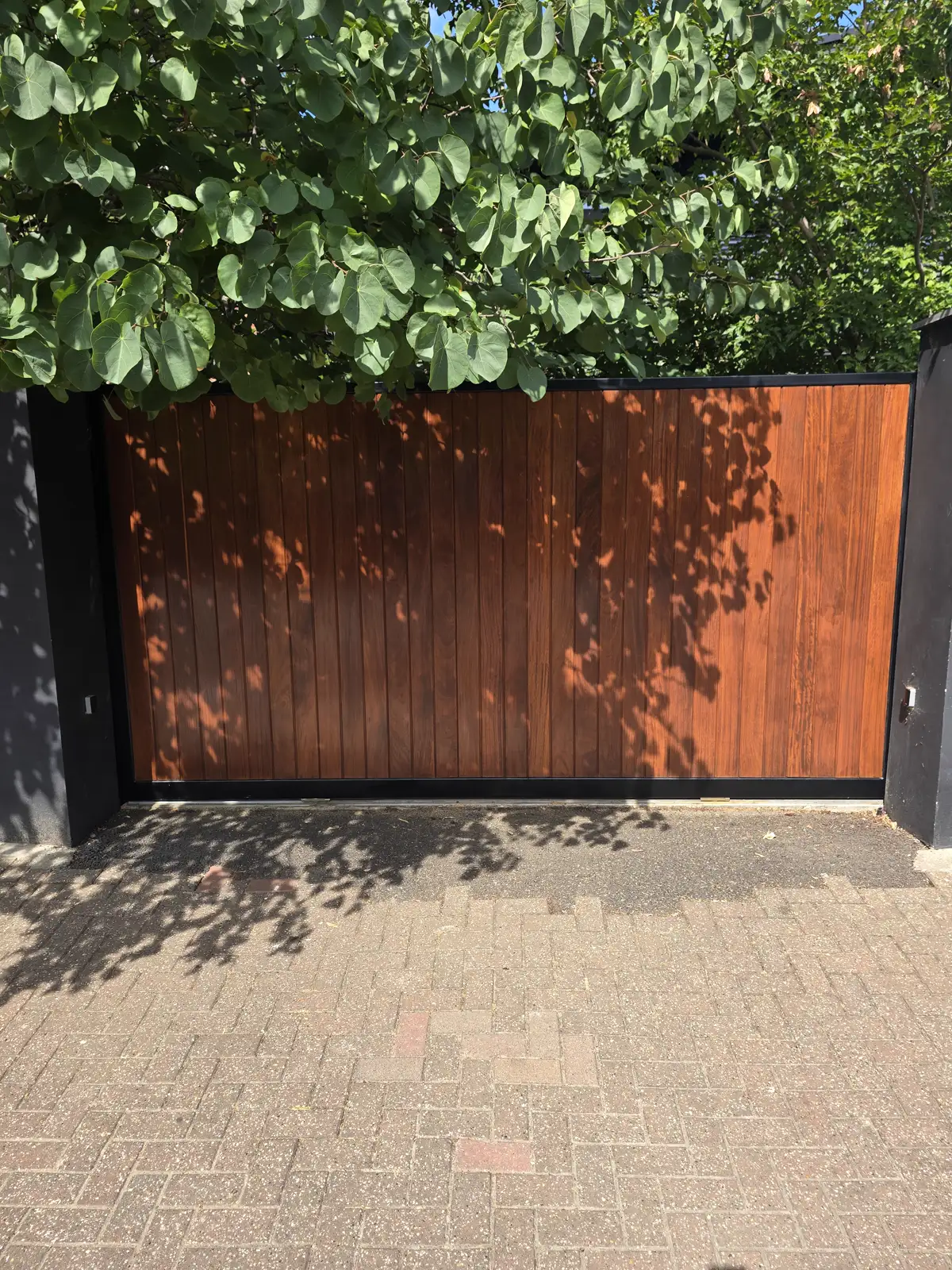 Richmond front door after hand sanding and two coats of UV-resistant oil, deep rich hardwood finish