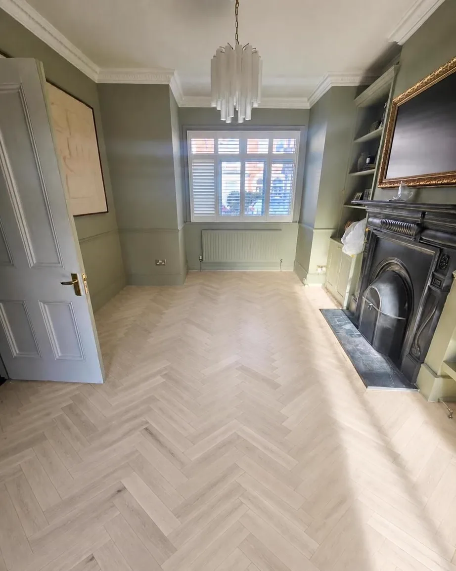 AI visualiser render of a bare pine room with an unfinished oak herringbone floor