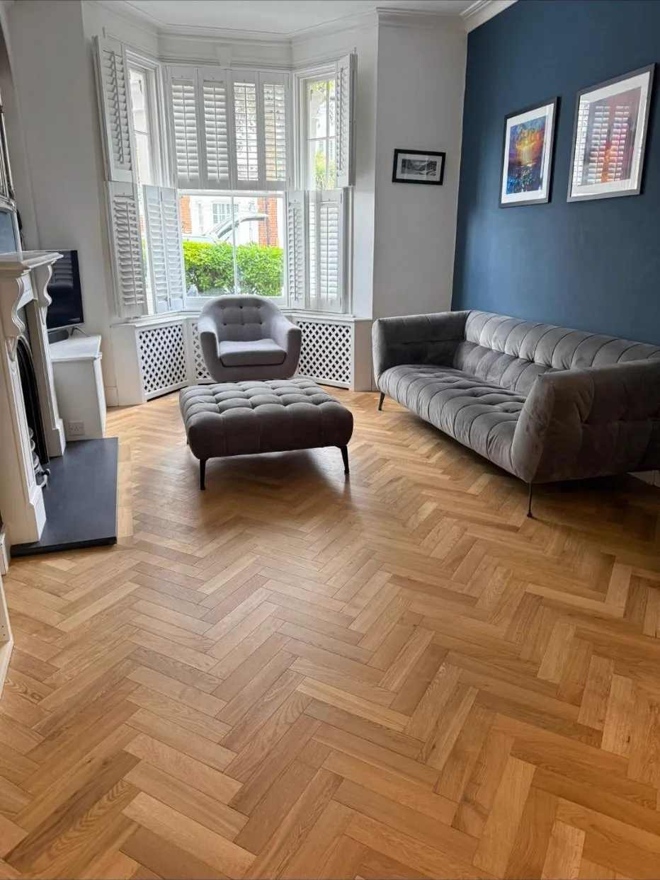 Herringbone oak parquet floor installation in a Wimbledon SW19 living room by Howard Naish